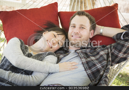 To use this stock image in your creative project, please select the size you need over to the right and click the "Add to Cart" button.
Your downloaded image will come with the Cutcaster watermark removed so don’t worry about the watermark you see on this page. Mixed Race Couple Relaxing in a Hammock stock photo, Happy Mixed Race Couple Relaxing in a Hammock Outside. by Andy Dean