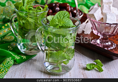 To use this stock image in your creative project, please select the size you need over to the right and click the "Add to Cart" button.
Your downloaded image will come with the Cutcaster watermark removed so don’t worry about the watermark you see on this page. Tea with mint stock photo, Traditional Oriental tea with mint leaves in a glass by zia_shusha