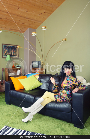 To use this stock image in your creative project, please select the size you need over to the right and click the "Add to Cart" button.
Your downloaded image will come with the Cutcaster watermark removed so don’t worry about the watermark you see on this page. Pretty Woman on Sofa stock photo, Laid back pretty retro woman sitting on leather sofa by Scott Griessel