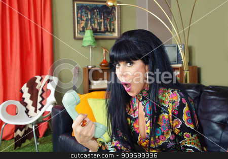 To use this stock image in your creative project, please select the size you need over to the right and click the "Add to Cart" button.
Your downloaded image will come with the Cutcaster watermark removed so don’t worry about the watermark you see on this page. Embarrassed Lady on Phone stock photo, Embarrased single 1960s woman on sofa holding telephone by Scott Griessel