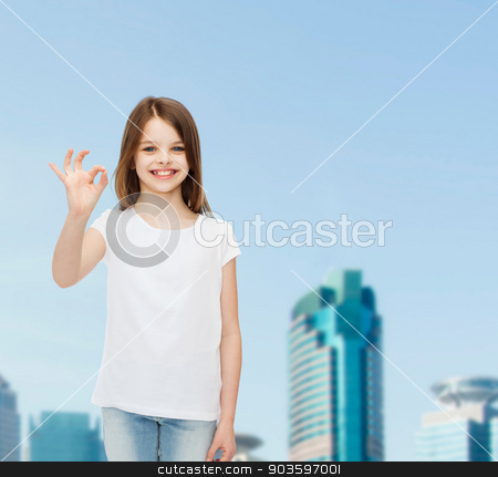 To use this stock image in your creative project, please select the size you need over to the right and click the "Add to Cart" button.
Your downloaded image will come with the Cutcaster watermark removed so don’t worry about the watermark you see on this page. smiling little girl in white blank t-shirt stock photo, advertising, childhood, city, gesture and people concept - smiling girl in white t-shirt showing ok sign over business center background by Syda Productions