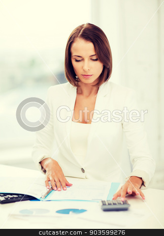 To use this stock image in your creative project, please select the size you need over to the right and click the "Add to Cart" button.
Your downloaded image will come with the Cutcaster watermark removed so don’t worry about the watermark you see on this page. businesswoman working with calculator in office stock photo, business concept - businesswoman working with calculator in office by Syda Productions