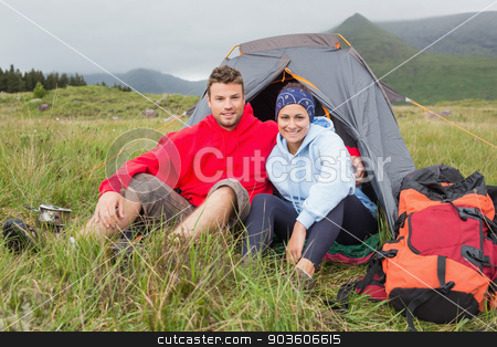 To use this stock image in your creative project, please select the size you need over to the right and click the "Add to Cart" button.
Your downloaded image will come with the Cutcaster watermark removed so don’t worry about the watermark you see on this page. Couple on camping trip smiling at camera stock photo, Couple on camping trip smiling at camera outside their tent by Wavebreak Media