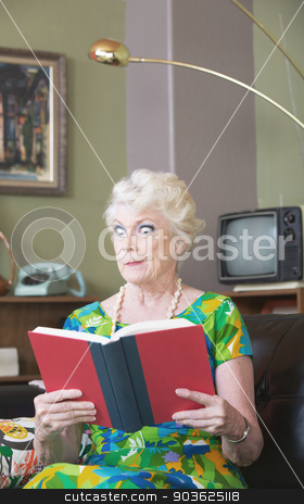 To use this stock image in your creative project, please select the size you need over to the right and click the "Add to Cart" button.
Your downloaded image will come with the Cutcaster watermark removed so don’t worry about the watermark you see on this page. Skeptical Woman with Book stock photo, Single skeptical woman in green reading a book by Scott Griessel