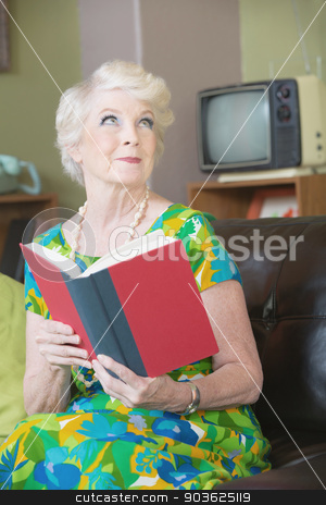 To use this stock image in your creative project, please select the size you need over to the right and click the "Add to Cart" button.
Your downloaded image will come with the Cutcaster watermark removed so don’t worry about the watermark you see on this page. Grinning Woman with Book stock photo, Enchanted woman with grin reading a book by Scott Griessel