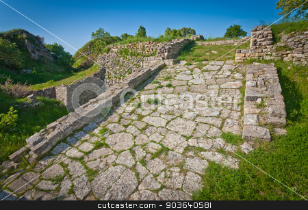 To use this stock image in your creative project, please select the size you need over to the right and click the "Add to Cart" button.
Your downloaded image will come with the Cutcaster watermark removed so don’t worry about the watermark you see on this page. Acropolis Road at Troy in Turkey stock photo, Roadway atop acropolis wall at Troy in Turkey by Scott Griessel