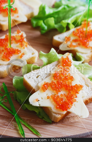 To use this stock image in your creative project, please select the size you need over to the right and click the "Add to Cart" button.
Your downloaded image will come with the Cutcaster watermark removed so don’t worry about the watermark you see on this page. festive sandwiches stock photo, sandwiches in the shape of a christmas tree with cheese and caviar. holidays and events by Jevgeni Proshin