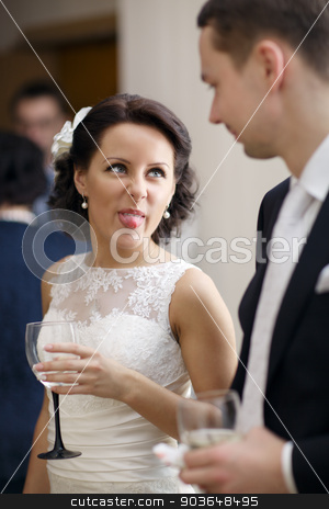 To use this stock image in your creative project, please select the size you need over to the right and click the "Add to Cart" button.
Your downloaded image will come with the Cutcaster watermark removed so don’t worry about the watermark you see on this page. Bride and groom enjoy a drink at the wedding stock photo, Bride and groom enjoy a quiet moment together and a drink of white wine at their wedding reception by danr13