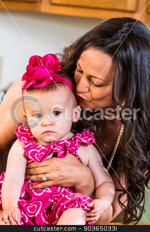 To use this stock image in your creative project, please select the size you need over to the right and click the "Add to Cart" button.
Your downloaded image will come with the Cutcaster watermark removed so don’t worry about the watermark you see on this page. Woman Kisses Baby stock photo, Woman in kitchen kisses her baby by Scott Griessel
