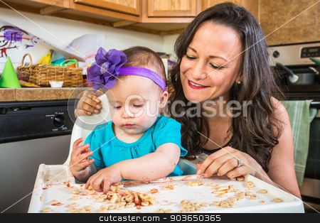 To use this stock image in your creative project, please select the size you need over to the right and click the "Add to Cart" button.
Your downloaded image will come with the Cutcaster watermark removed so don’t worry about the watermark you see on this page. Mother Smiles With Baby stock photo, Mother in messy kitchen smiles as baby eats by Scott Griessel