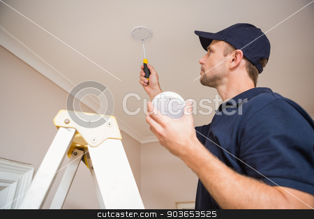 To use this stock image in your creative project, please select the size you need over to the right and click the "Add to Cart" button.
Your downloaded image will come with the Cutcaster watermark removed so don’t worry about the watermark you see on this page. Handyman installing smoke detector stock photo, Handyman installing smoke detector with screwdriver on the ceiling by Wavebreak Media