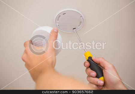 To use this stock image in your creative project, please select the size you need over to the right and click the "Add to Cart" button.
Your downloaded image will come with the Cutcaster watermark removed so don’t worry about the watermark you see on this page. Handyman installing smoke detector stock photo, Handyman installing smoke detector with screwdriver on the ceiling by Wavebreak Media