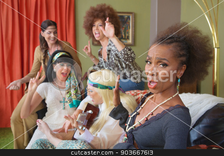 To use this stock image in your creative project, please select the size you need over to the right and click the "Add to Cart" button.
Your downloaded image will come with the Cutcaster watermark removed so don’t worry about the watermark you see on this page. Annoying Guitar Player stock photo, Woman bothered with 1960s friends playing guitar by Scott Griessel