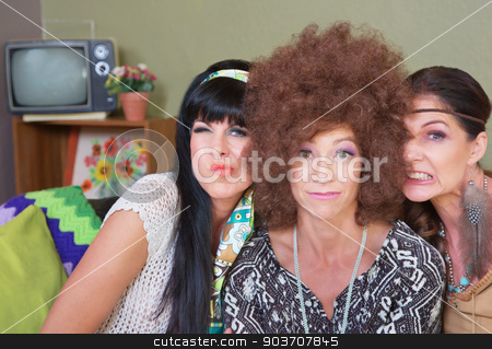 To use this stock image in your creative project, please select the size you need over to the right and click the "Add to Cart" button.
Your downloaded image will come with the Cutcaster watermark removed so don’t worry about the watermark you see on this page. Cute Ladies Making Faces stock photo, Three cute women in 1960s fashion making faces by Scott Griessel