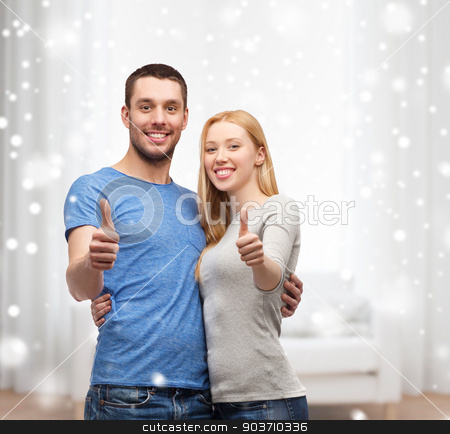 To use this stock image in your creative project, please select the size you need over to the right and click the "Add to Cart" button.
Your downloaded image will come with the Cutcaster watermark removed so don’t worry about the watermark you see on this page. happy couple showing thumbs up and hugging stock photo, love, people and family concept - smiling couple snowing thumbs up gesture and hugging at home by Syda Productions