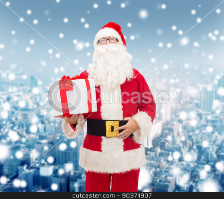 To use this stock image in your creative project, please select the size you need over to the right and click the "Add to Cart" button.
Your downloaded image will come with the Cutcaster watermark removed so don’t worry about the watermark you see on this page. man in costume of santa claus with gift box stock photo, christmas, holidays and people concept - man in costume of santa claus with gift box over snowy city background by Syda Productions