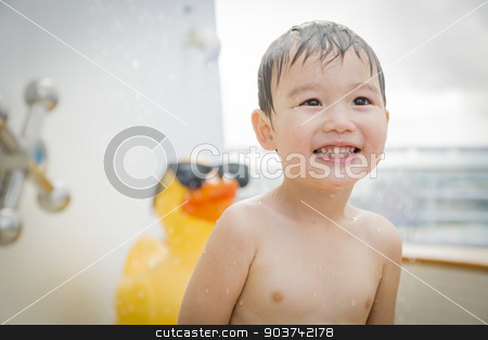To use this stock image in your creative project, please select the size you need over to the right and click the "Add to Cart" button.
Your downloaded image will come with the Cutcaster watermark removed so don’t worry about the watermark you see on this page. Mixed Race Boy Having Fun at the Water Park stock photo, Mixed Race Boy Having Fun at the Water Park with Large Rubber Duck in the Background. by Andy Dean