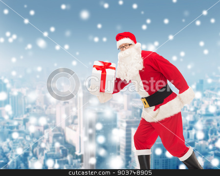To use this stock image in your creative project, please select the size you need over to the right and click the "Add to Cart" button.
Your downloaded image will come with the Cutcaster watermark removed so don’t worry about the watermark you see on this page. man in costume of santa claus with gift box stock photo, christmas, holidays and people concept - man in costume of santa claus running with gift box over snowy city background by Syda Productions