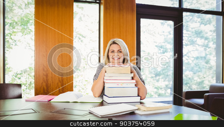 To use this stock image in your creative project, please select the size you need over to the right and click the "Add to Cart" button.
Your downloaded image will come with the Cutcaster watermark removed so don’t worry about the watermark you see on this page. Smiling blonde mature student with stack of books stock photo, Smiling blonde mature student with stack of books in library by Wavebreak Media