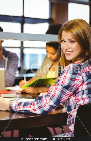To use this stock image in your creative project, please select the size you need over to the right and click the "Add to Cart" button.
Your downloaded image will come with the Cutcaster watermark removed so don’t worry about the watermark you see on this page. Portrait of a smiling student sitting at desk looking at camera stock photo, Portrait of a smiling student sitting at desk looking at camera in library by Wavebreak Media