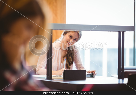 To use this stock image in your creative project, please select the size you need over to the right and click the "Add to Cart" button.
Your downloaded image will come with the Cutcaster watermark removed so don’t worry about the watermark you see on this page. Smiling student sitting next to the window taking notes stock photo, Smiling student sitting next to the window taking notes in library by Wavebreak Media
