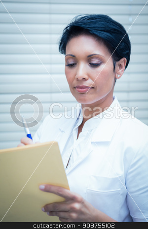To use this stock image in your creative project, please select the size you need over to the right and click the "Add to Cart" button.
Your downloaded image will come with the Cutcaster watermark removed so don’t worry about the watermark you see on this page. Female dentist reading reports stock photo, Serious female dentist reading reports by Wavebreak Media