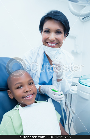 To use this stock image in your creative project, please select the size you need over to the right and click the "Add to Cart" button.
Your downloaded image will come with the Cutcaster watermark removed so don’t worry about the watermark you see on this page. Portrait of smiling female dentist examining boys teeth stock photo, Portrait of smiling female dentist examining boys teeth in the dentists chair by Wavebreak Media
