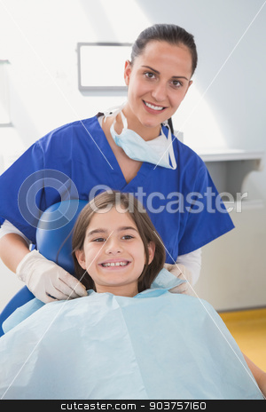 To use this stock image in your creative project, please select the size you need over to the right and click the "Add to Cart" button.
Your downloaded image will come with the Cutcaster watermark removed so don’t worry about the watermark you see on this page. Pediatric dentist putting on her young patient the scrubs stock photo, Pediatric dentist putting on her young patient the scrubs in dental clinic by Wavebreak Media