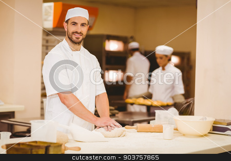 To use this stock image in your creative project, please select the size you need over to the right and click the "Add to Cart" button.
Your downloaded image will come with the Cutcaster watermark removed so don’t worry about the watermark you see on this page. Baker kneading dough at a counter stock photo, Baker kneading dough at a counter in a commercial kitchen by Wavebreak Media