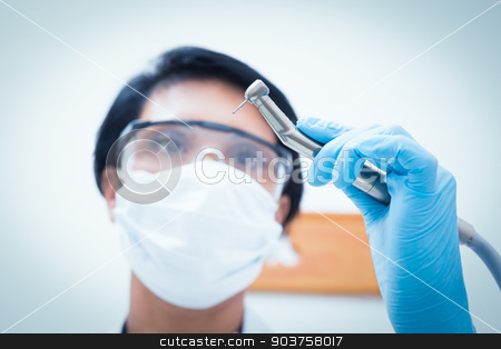 To use this stock image in your creative project, please select the size you need over to the right and click the "Add to Cart" button.
Your downloaded image will come with the Cutcaster watermark removed so don’t worry about the watermark you see on this page. Female dentist in surgical mask holding dental drill stock photo, Portrait of female dentist in surgical mask holding dental drill by Wavebreak Media
