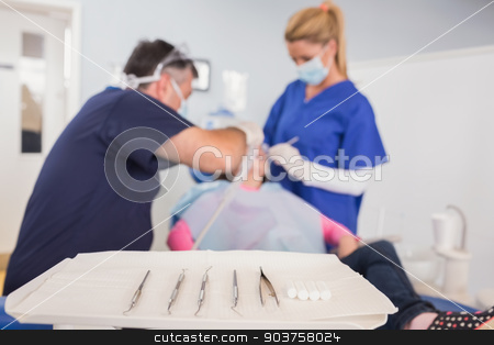 To use this stock image in your creative project, please select the size you need over to the right and click the "Add to Cart" button.
Your downloaded image will come with the Cutcaster watermark removed so don’t worry about the watermark you see on this page. Dentist and his dental assistant examining a young patient stock photo, Dentist and his dental assistant examining a young patient in dental clinic by Wavebreak Media
