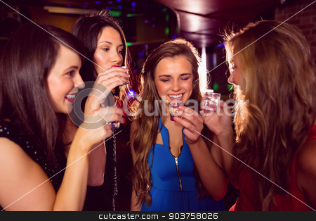 To use this stock image in your creative project, please select the size you need over to the right and click the "Add to Cart" button.
Your downloaded image will come with the Cutcaster watermark removed so don’t worry about the watermark you see on this page. Pretty friends drinking shots together stock photo, Pretty friends drinking shots together at the nightclub by Wavebreak Media