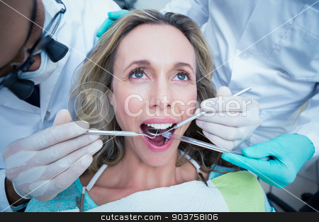 To use this stock image in your creative project, please select the size you need over to the right and click the "Add to Cart" button.
Your downloaded image will come with the Cutcaster watermark removed so don’t worry about the watermark you see on this page. Close up of woman having her teeth examined stock photo, Close up of woman having her teeth examined by dentist and assistant by Wavebreak Media