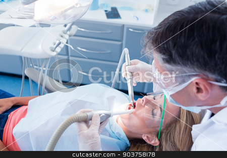 To use this stock image in your creative project, please select the size you need over to the right and click the "Add to Cart" button.
Your downloaded image will come with the Cutcaster watermark removed so don’t worry about the watermark you see on this page. Dentist examining his patient with a suction hose stock photo, Dentist examining his patient with a suction hose at the dental clinic by Wavebreak Media
