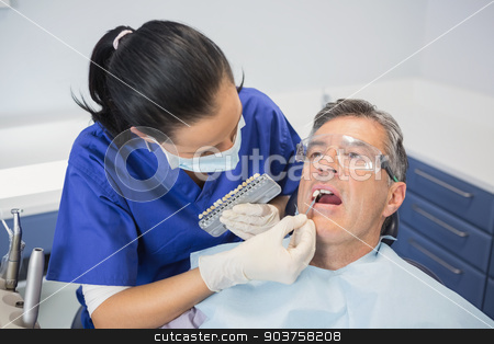 To use this stock image in your creative project, please select the size you need over to the right and click the "Add to Cart" button.
Your downloaded image will come with the Cutcaster watermark removed so don’t worry about the watermark you see on this page. Dentist comparing teeth whitening stock photo, Dentist comparing teeth whitening of her patient in dental clinic by Wavebreak Media