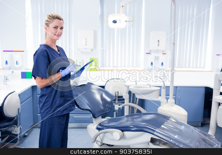 To use this stock image in your creative project, please select the size you need over to the right and click the "Add to Cart" button.
Your downloaded image will come with the Cutcaster watermark removed so don’t worry about the watermark you see on this page. Smiling dentist working on tablet pc and looking at camera stock photo, Smiling dentist working on tablet pc and looking at camera at the dental clinic by Wavebreak Media