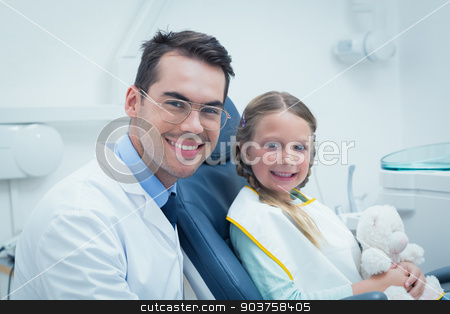 To use this stock image in your creative project, please select the size you need over to the right and click the "Add to Cart" button.
Your downloaded image will come with the Cutcaster watermark removed so don’t worry about the watermark you see on this page. Male dentist examining girls teeth stock photo, Male dentist examining girls teeth in the dentists chair by Wavebreak Media