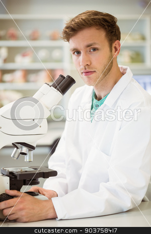 To use this stock image in your creative project, please select the size you need over to the right and click the "Add to Cart" button.
Your downloaded image will come with the Cutcaster watermark removed so don’t worry about the watermark you see on this page. Young scientist working with microscope stock photo, Young scientist working with microscope at the university by Wavebreak Media