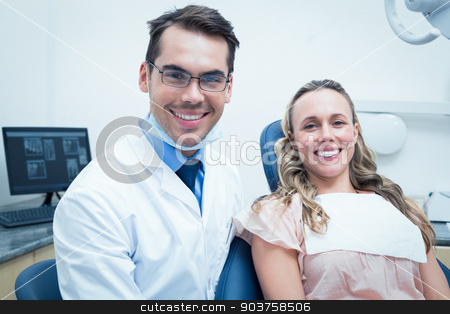 To use this stock image in your creative project, please select the size you need over to the right and click the "Add to Cart" button.
Your downloaded image will come with the Cutcaster watermark removed so don’t worry about the watermark you see on this page. Dentist examining young womans teeth stock photo, Dentist examining young womans teeth in the dentists chair by Wavebreak Media
