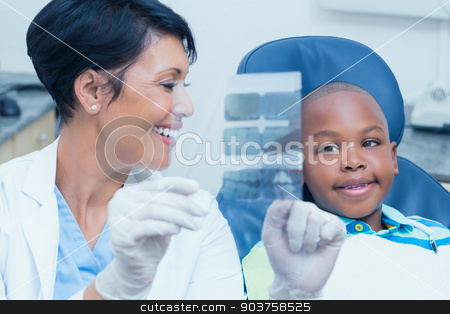 To use this stock image in your creative project, please select the size you need over to the right and click the "Add to Cart" button.
Your downloaded image will come with the Cutcaster watermark removed so don’t worry about the watermark you see on this page. Female dentist showing boy his mouth x-ray stock photo, Female dentist showing young boy his mouth x-ray in the dentists chair by Wavebreak Media