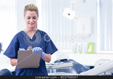 To use this stock image in your creative project, please select the size you need over to the right and click the "Add to Cart" button.
Your downloaded image will come with the Cutcaster watermark removed so don’t worry about the watermark you see on this page. Smiling dentist writing in clipboard stock photo, Smiling dentist writing in clipboard at the dental clinic by Wavebreak Media