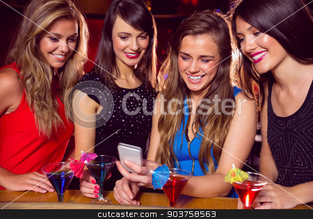 To use this stock image in your creative project, please select the size you need over to the right and click the "Add to Cart" button.
Your downloaded image will come with the Cutcaster watermark removed so don’t worry about the watermark you see on this page. Pretty friends looking at smartphone together stock photo, Pretty friends looking at smartphone together at the nightclub by Wavebreak Media