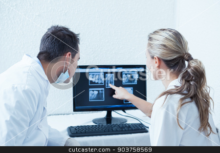 To use this stock image in your creative project, please select the size you need over to the right and click the "Add to Cart" button.
Your downloaded image will come with the Cutcaster watermark removed so don’t worry about the watermark you see on this page. Dentists looking at x-ray on computer stock photo, Two concentrated dentists looking at x-ray on computer by Wavebreak Media
