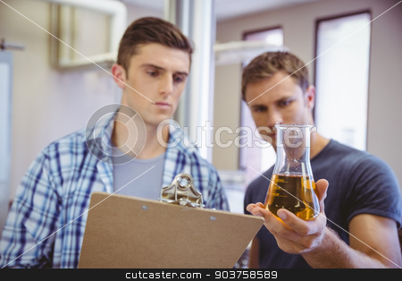 To use this stock image in your creative project, please select the size you need over to the right and click the "Add to Cart" button.
Your downloaded image will come with the Cutcaster watermark removed so don’t worry about the watermark you see on this page. Two men looking at the beaker with beer stock photo, Two men looking at the beaker with beer in the factory by Wavebreak Media