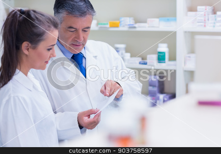 To use this stock image in your creative project, please select the size you need over to the right and click the "Add to Cart" button.
Your downloaded image will come with the Cutcaster watermark removed so don’t worry about the watermark you see on this page. Pharmacist explaining a prescription to his trainee stock photo, Pharmacist explaining a prescription to his trainee in the pharmacy by Wavebreak Media