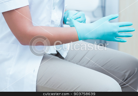 To use this stock image in your creative project, please select the size you need over to the right and click the "Add to Cart" button.
Your downloaded image will come with the Cutcaster watermark removed so don’t worry about the watermark you see on this page. Mid section of dentist wearing surgical glove stock photo, Close up mid section of female dentist wearing surgical glove by Wavebreak Media