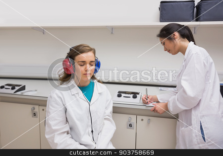 To use this stock image in your creative project, please select the size you need over to the right and click the "Add to Cart" button.
Your downloaded image will come with the Cutcaster watermark removed so don’t worry about the watermark you see on this page. Student doing a hearing test stock photo, Student doing a hearing test at the university by Wavebreak Media