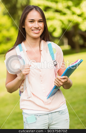 To use this stock image in your creative project, please select the size you need over to the right and click the "Add to Cart" button.
Your downloaded image will come with the Cutcaster watermark removed so don’t worry about the watermark you see on this page. Portrait of a smiling student with a shoulder bag and holding bo stock photo, Portrait of a smiling student with a shoulder bag and holding book in park at school by Wavebreak Media