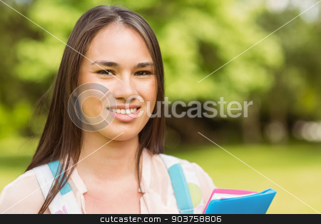 To use this stock image in your creative project, please select the size you need over to the right and click the "Add to Cart" button.
Your downloaded image will come with the Cutcaster watermark removed so don’t worry about the watermark you see on this page. Portrait of a smiling student with a shoulder bag and holding bo stock photo, Portrait of a smiling student with a shoulder bag and holding book in park at school by Wavebreak Media