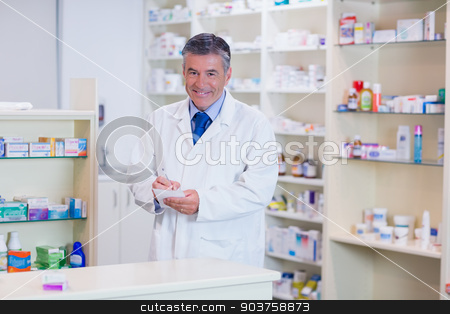 To use this stock image in your creative project, please select the size you need over to the right and click the "Add to Cart" button.
Your downloaded image will come with the Cutcaster watermark removed so don’t worry about the watermark you see on this page. Portrait of a smiling pharmacist writing down notes stock photo, Portrait of a smiling pharmacist writing down notes in the pharmacy by Wavebreak Media